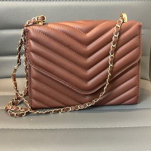 Brown purse with gold accents
